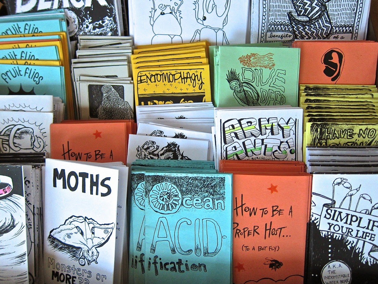 multiple zines stacked together